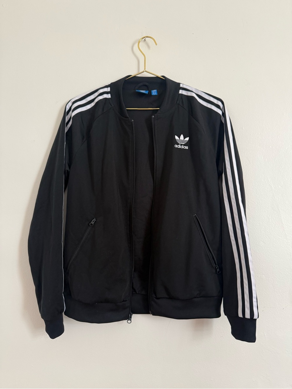 Iconic black adidas track jacket